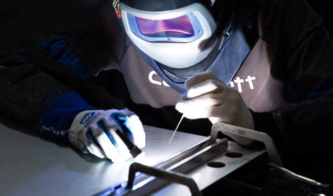 A welder at work at New Com Metals representing location photography services from Terrapin