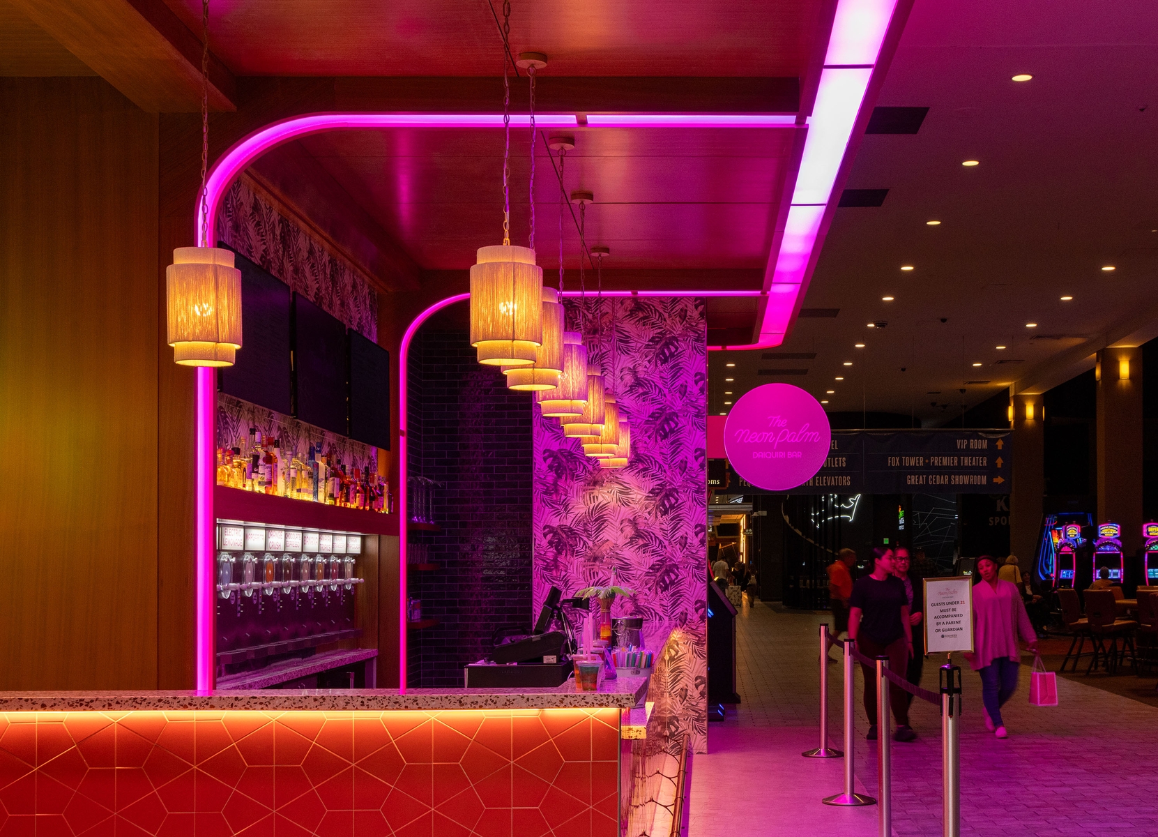 Side view of The Neon Palm looking down the concourse