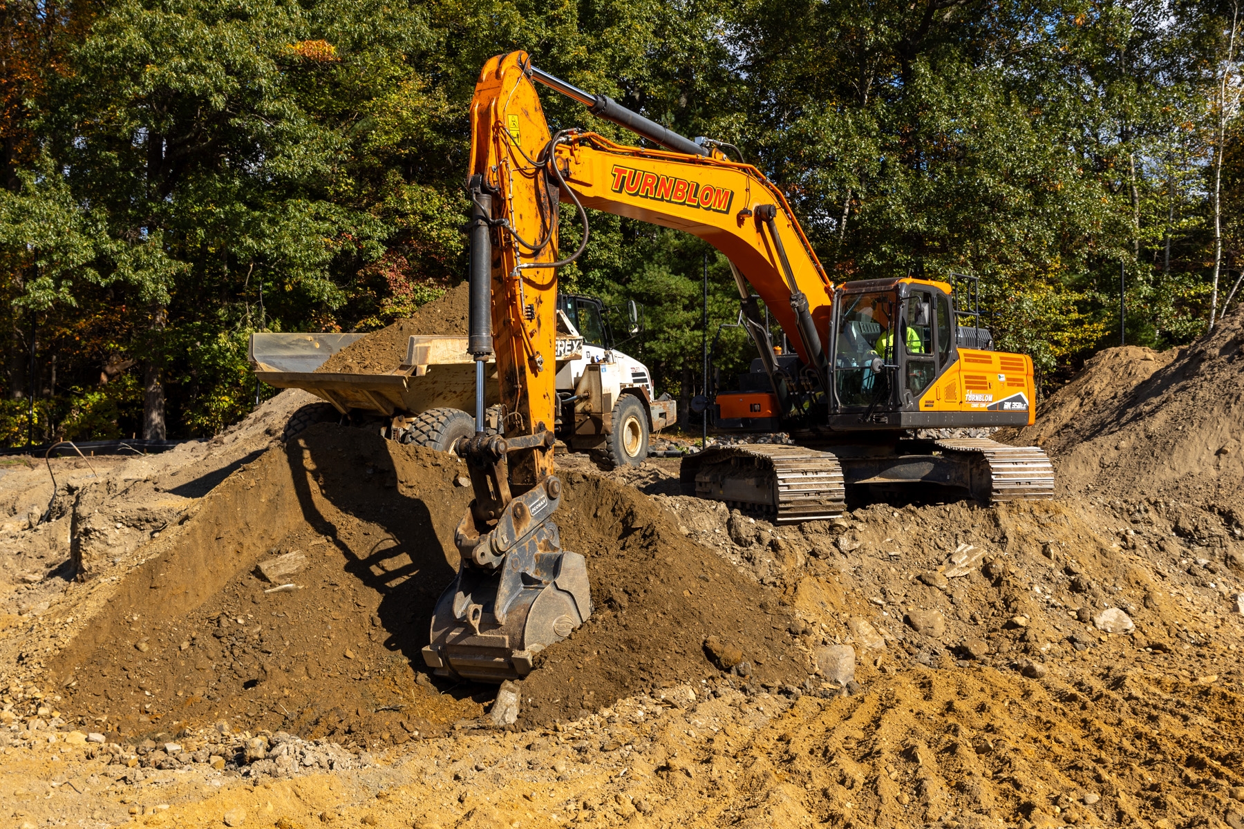 Excavator prepping site