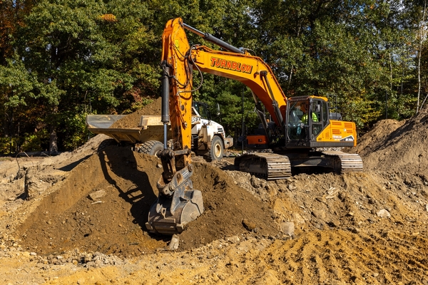 Excavator prepping site