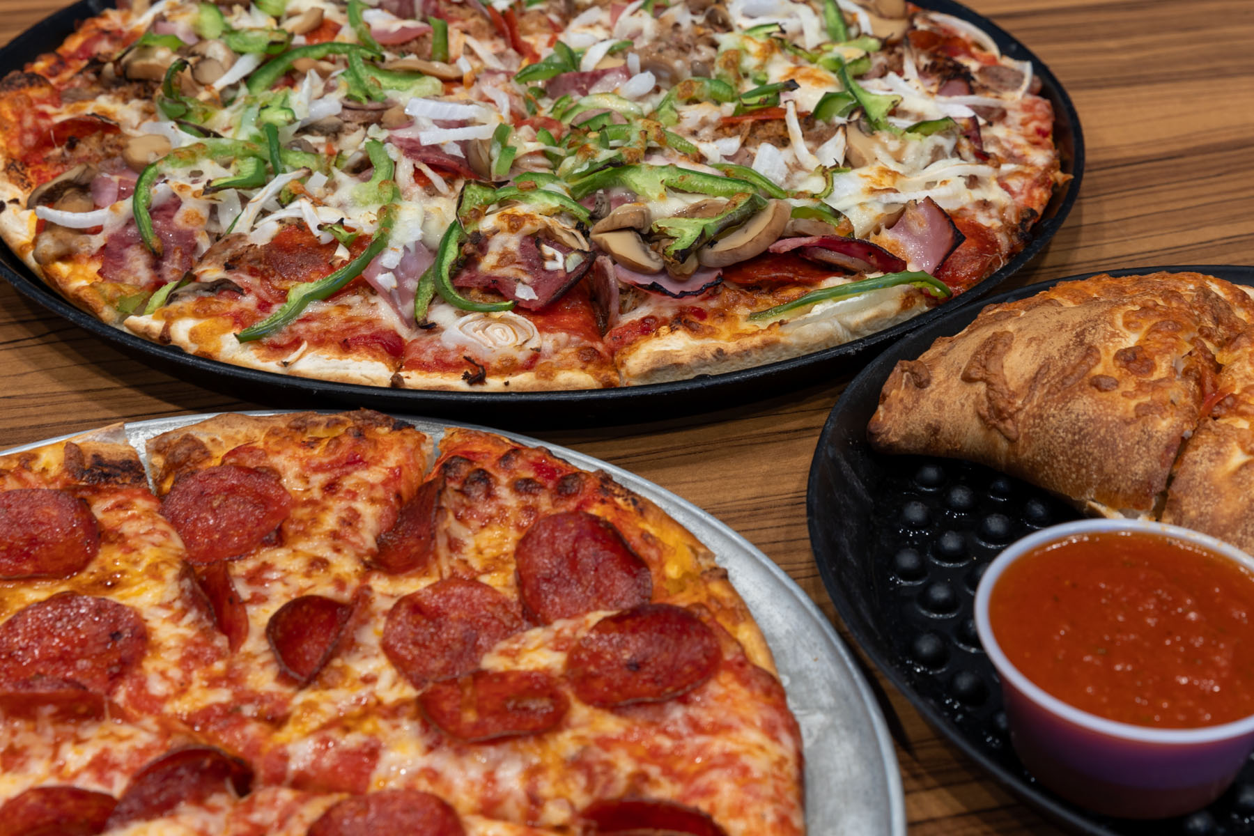 Pizza and calzone selections from CHOPS